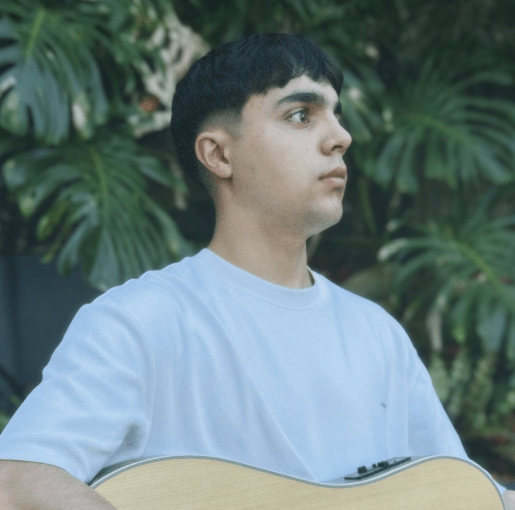 Harry Evans seen with a guitar on the Central Coast.